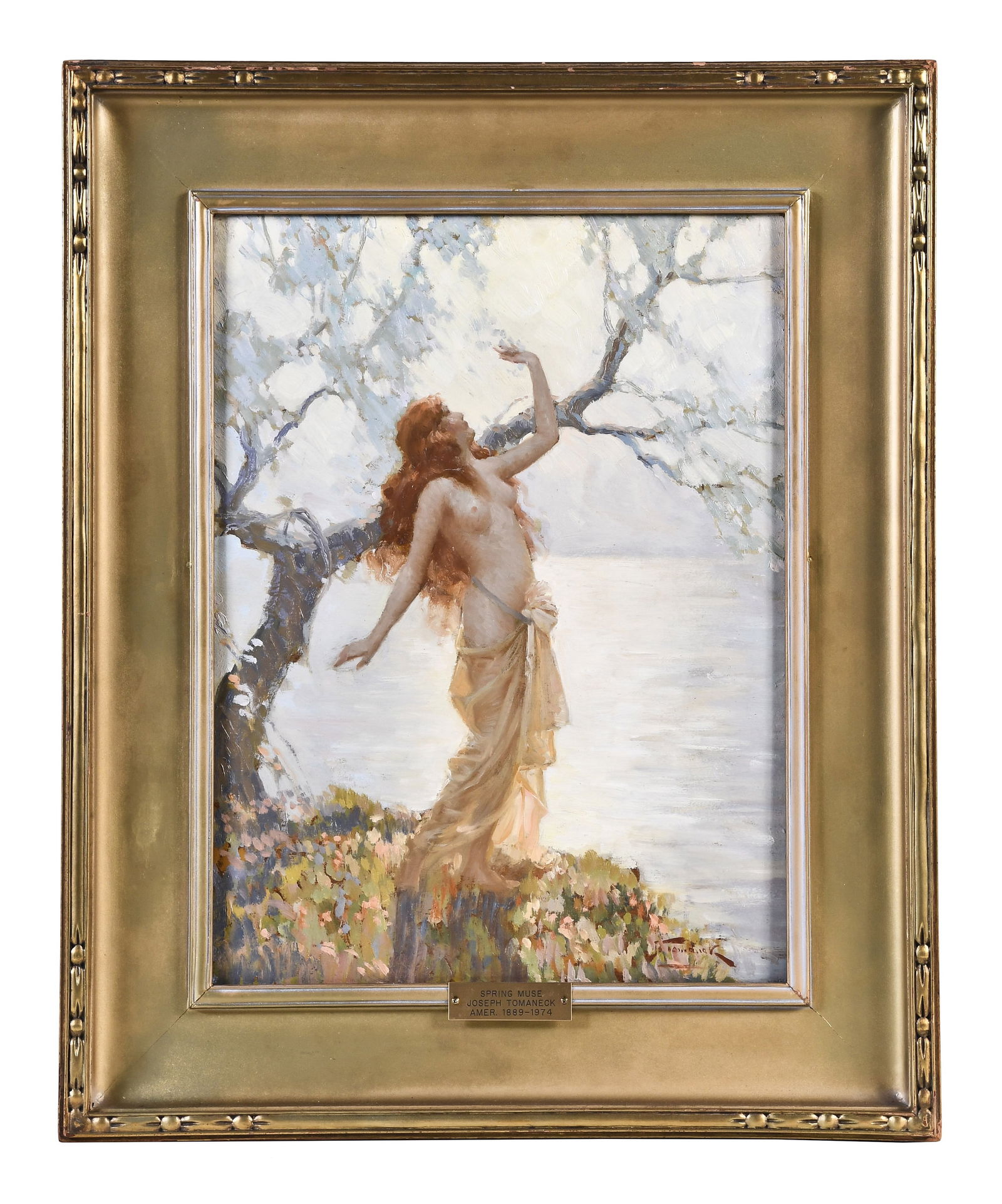 An early 20th century oil on board titled Spring Muse by Joseph Tomanek: Joseph Tomanek (1889 - 1974), "Spring Muse" the early 20th century oil on board featuring a semi nude, red haired woman in a landscape with tree and lake in the background, and in a pose reminiscent o