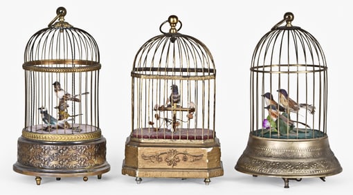 Three singing bird cages.