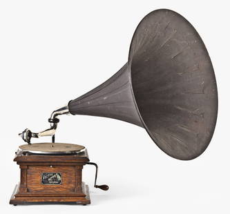 A Victor II disc phonograph with wood horn: Victor Talking Machine Co., Camden, NJ. "Victor II" model oak case disc phonograph with 22" diameter wood horn, horn 26" long