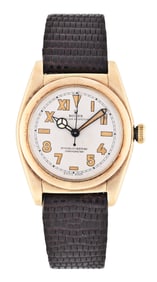 A mid 20th century gold Rolex ref. 6011 bubble back wrist watch with California dial