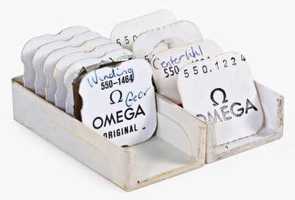 A lot of NOS watch material for the Omega cal. 550 movement