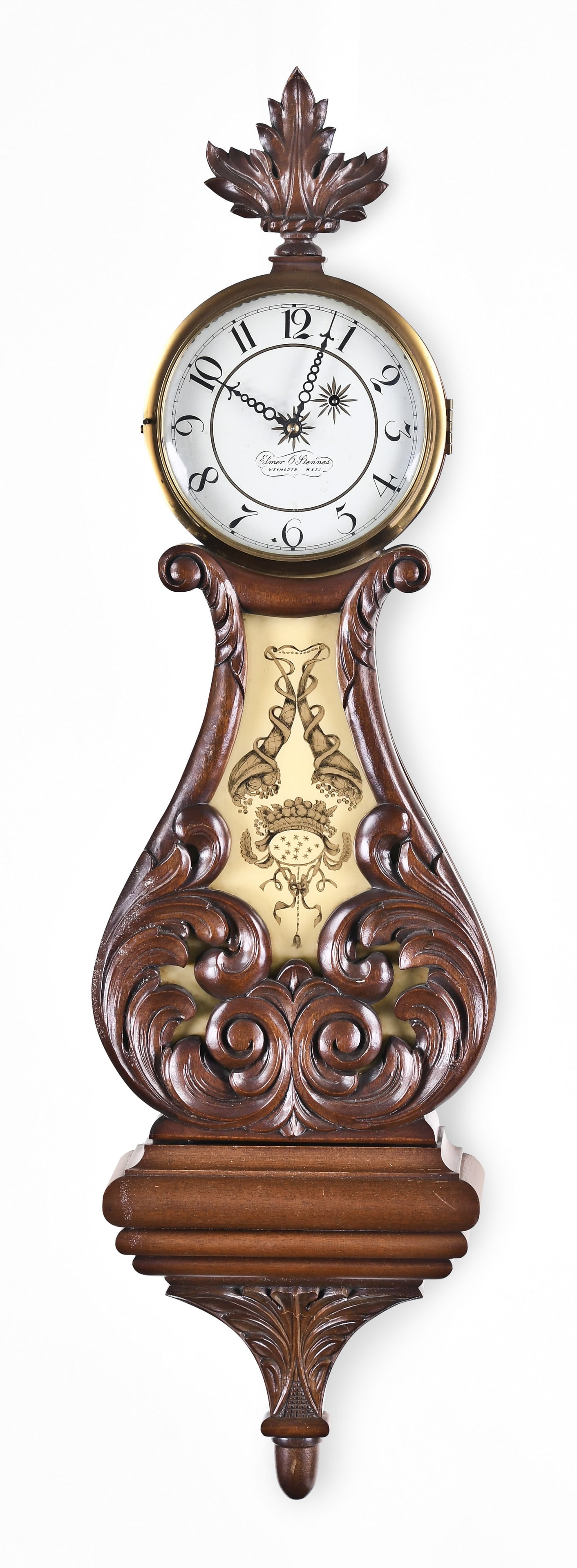 A Stennes true lyre wall clock: Elmer O. Stennes, Weymouth, Mass., true lyre wall clock, carved mahogany case, painted metal dial, 8 day, Curtis type hands, weight driven brass movement. Case is stamped: "11"