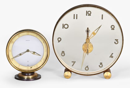 A lot of two desk or table clocks by LeCoultre and Cartier