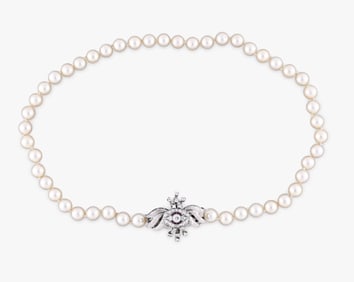 A good 15 inch pearl necklace with diamond and ruby set gold clasp/ pin