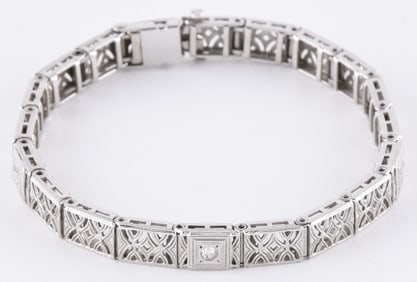 An early 20th century diamond set white gold bracelet