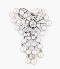 A good 20th century 14 karat gold diamond and pearl set abstract bow form pin