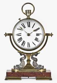 A large early 20th century paperweight clock with decorative stand