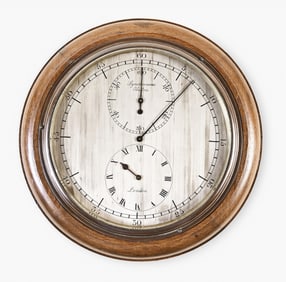 An early 20th century Synchronome slave clock with astronomical dial