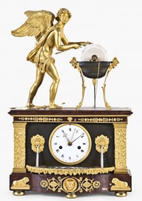 A fine and rare early 19th century French mantel clock with fountains and Cupid sharpening arrows