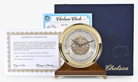 A Chelsea Clock Co. Centennial mantel clock with walnut stand