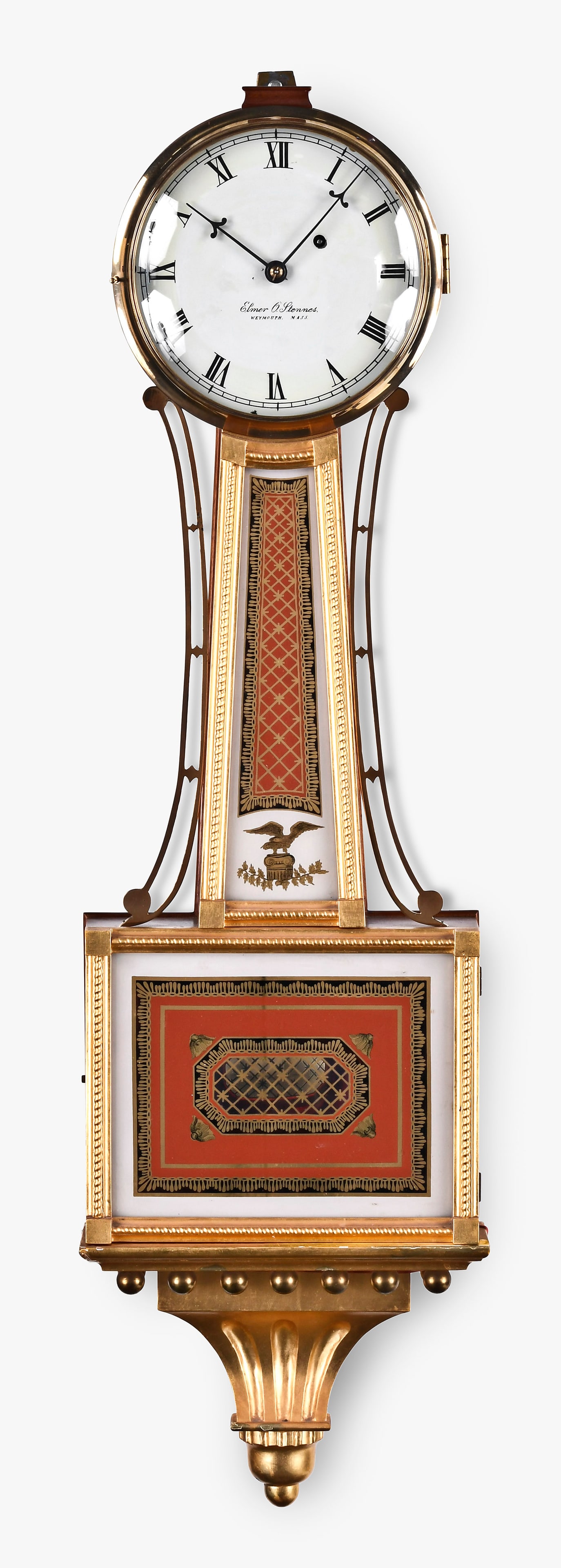 An Elmer Stennes gilt banjo clock: Elmer O. Stennes, Weymouth, Mass., patent timepiece or banjo clock, gilt mahogany case, painted metal dial, spear form hands, eight day, weight driven brass movement. Case is stamped "46 and "72". Cas