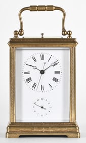 A French engraved Cannelee cased carriage clock with sweep seconds by J. Dejardin