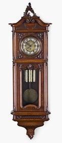 A Gustav Becker Vienna style quarter striking wall clock in a baroque style split case