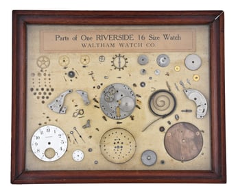 A good early 20th century Waltham countertop display with a disassembled Riverside movement
