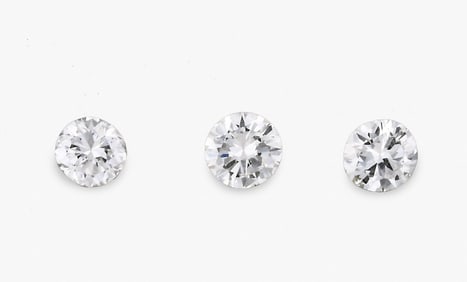 A lot of three loose round brilliant cut diamonds weighing .48 - .51 carats