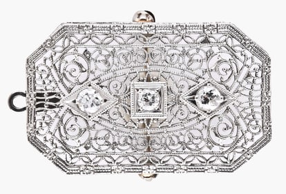 A good early 20th century 14 karat white gold diamond set filigree brooch