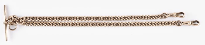 A good late 19th - early 20th century English 9 karat gold curb link double Albert watch chain