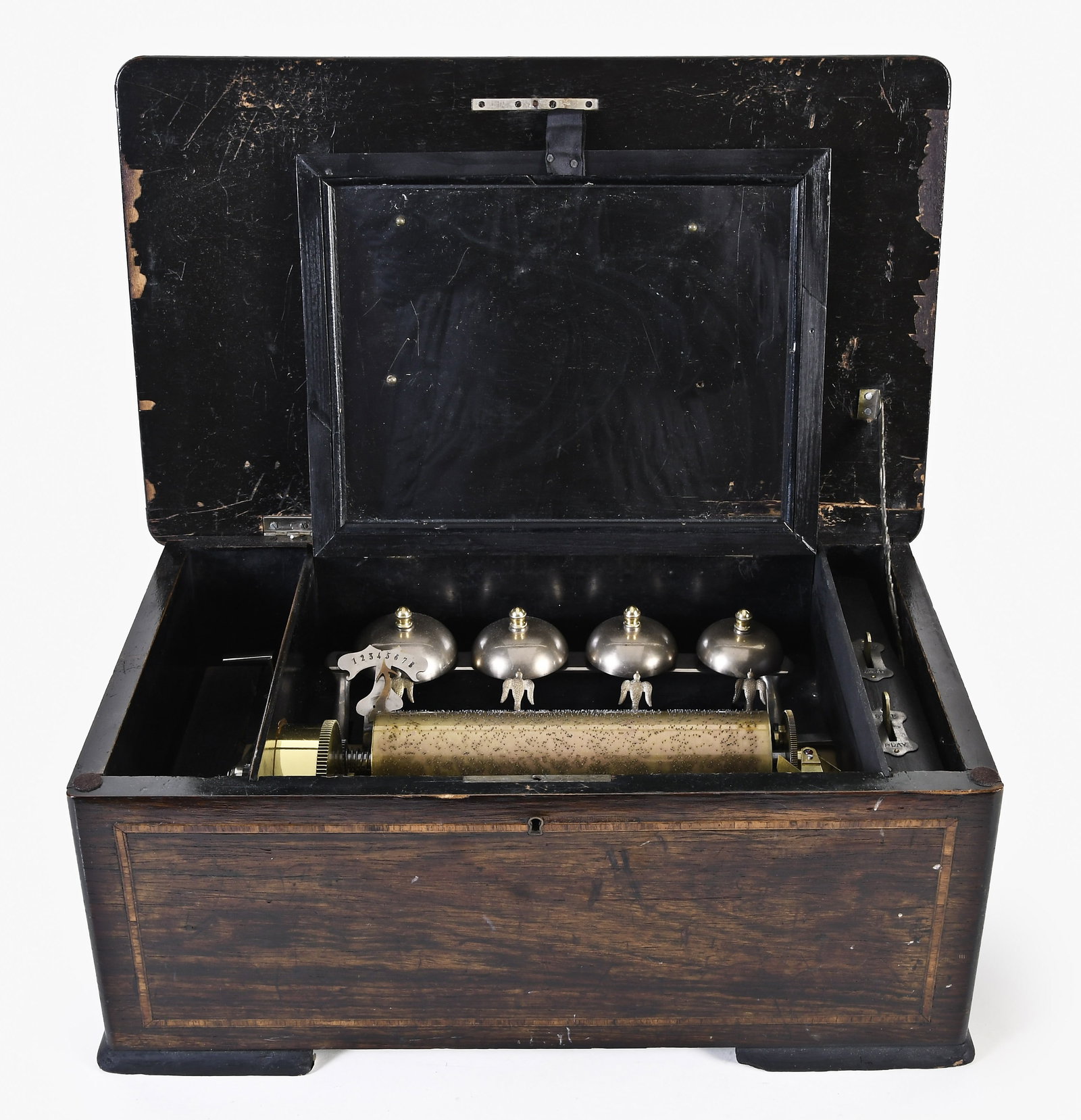 Swiss eight tune Bells in Vue cylinder music box: Switzerland, an eight tune "Bells in Vue" cylinder music box with birds striking four bells, in a rosewood veneered case with ebonized trim and line inlay, the top with marquetry decoration of scrolls