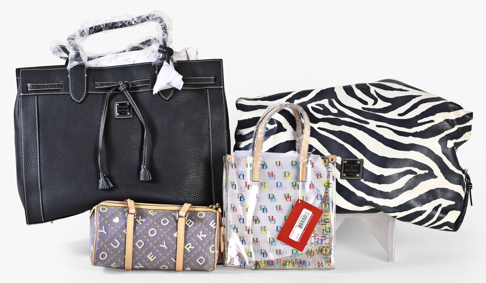 A lot of four late 20th - early 21st century Dooney & Bourke bags (1 of 2)