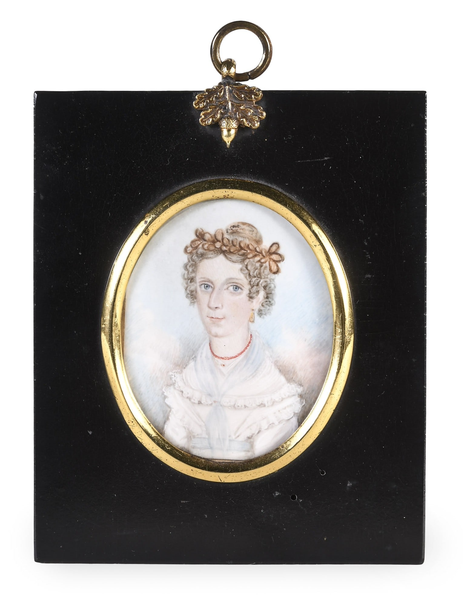 An early 19th century watercolor portrait on ivory of a young woman: An early 19th century watercolor portrait on ivory of a young woman, with blue eyes, her hair in ringlets, wearing a coral necklace and in a white Grecian dress, and contained in an ebonized papier ma