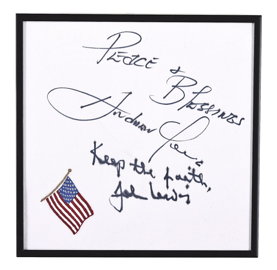 A 20th - 21st century square cloth with embroidered flag signed by John Lewis and Andrew Young: A 20th - 21st century square cloth with embroidered flag, signed in pen "Peace + Blessings Andrew Young" and "Keep the faith John Lewis", contained in a black metal frame
