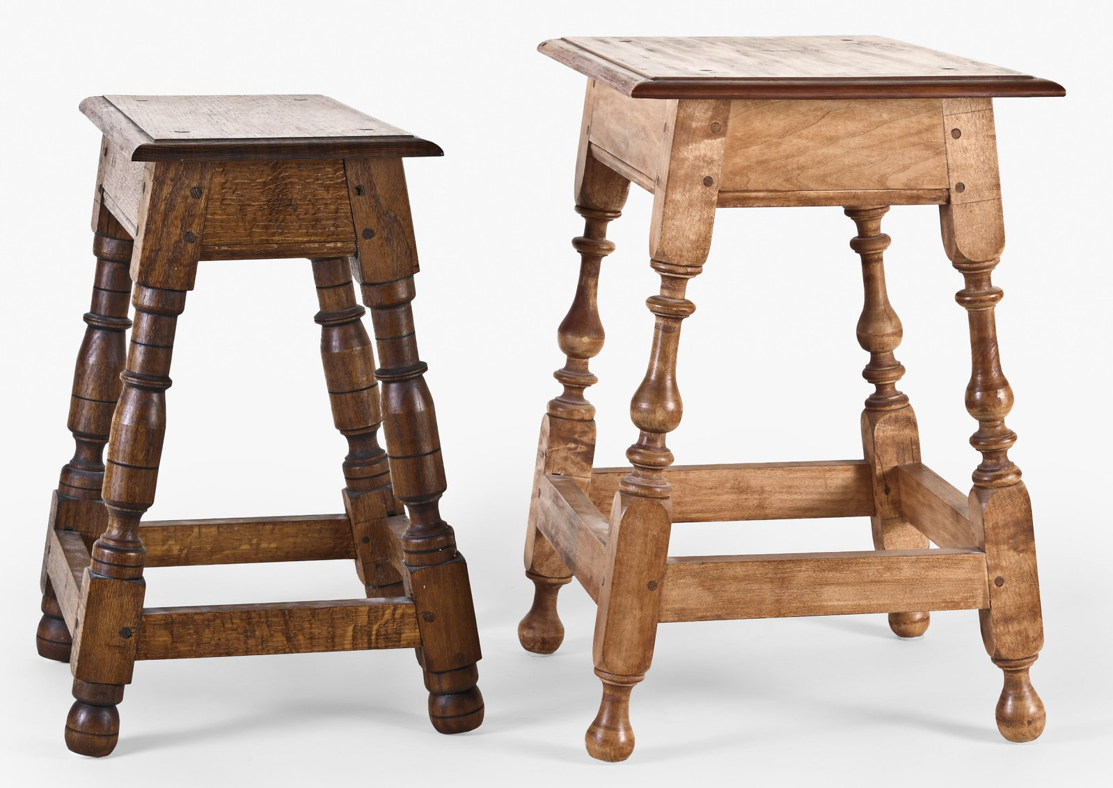 A lot of two late 20th - early 21st century reproduction joint stools based on American examples: 2 (Two) reproduction joint stools based on early Massachusetts examples, the first in the late 17th century style and of riven oak, with turned legs, molded apron, and molded rectangular top, the whol