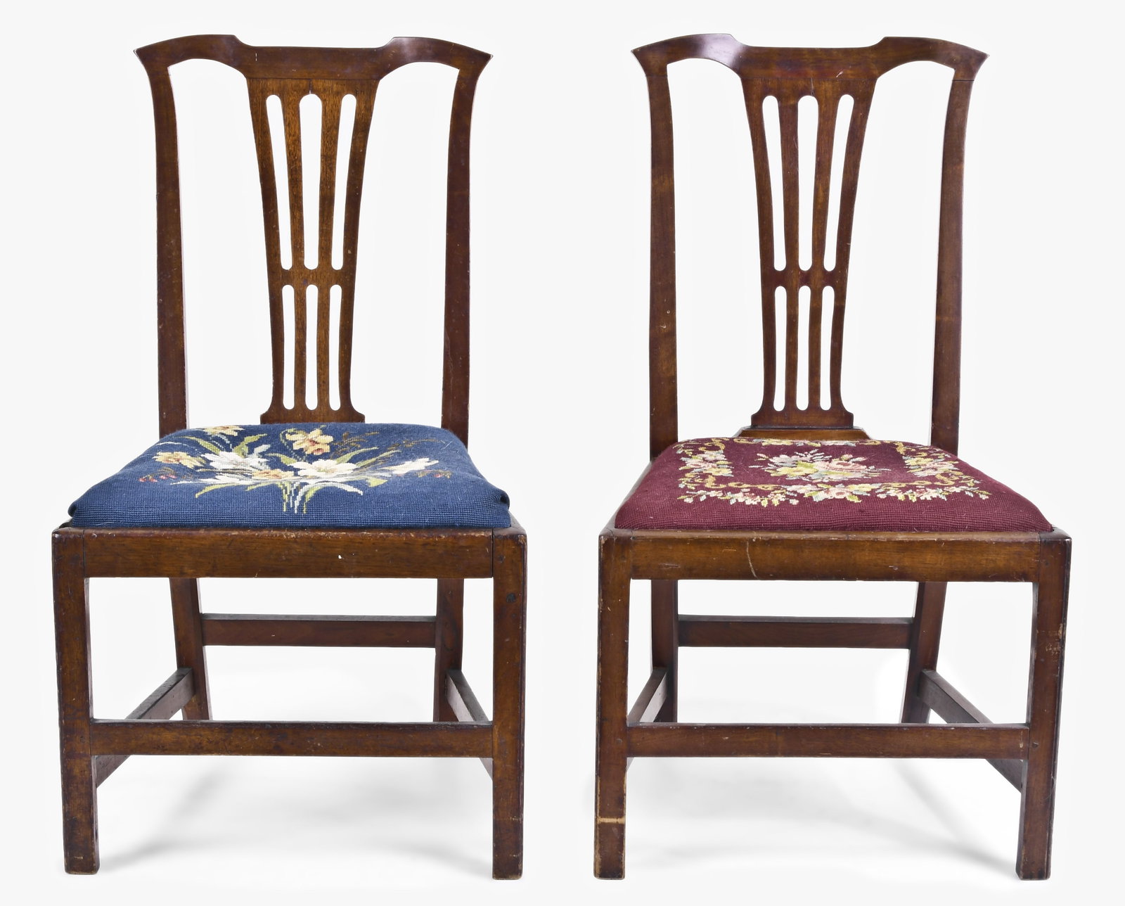 A pair of late 18th century English Chippendale mahogany side chairs: A pair of late 18th century English Chippendale mahogany side chairs, with needlepoint slip seats, box stretchers, front legs with molded corners, simple, tapered, pierced splats and flattened oxbow c