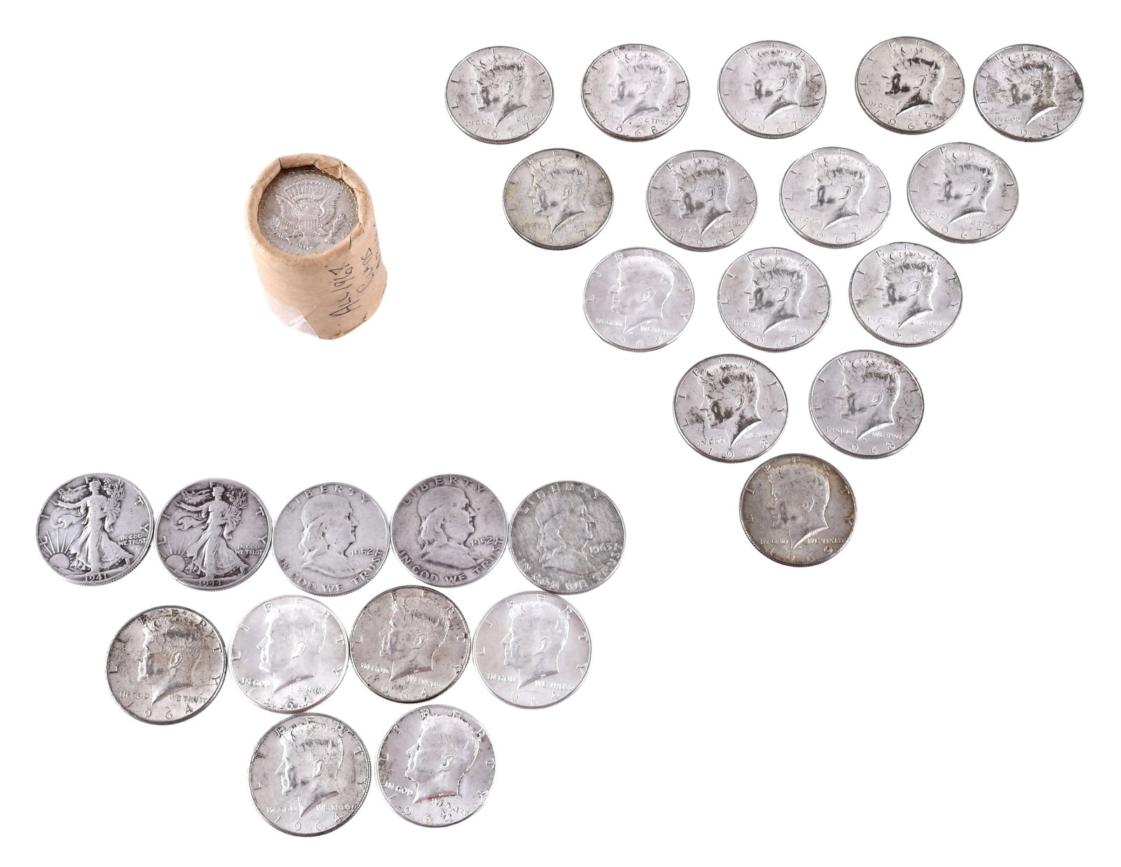 A lot of United States half dollars: A lot of United States half dollars including a small roll of Kennedy half dollars, together with twenty one loose Kennedy half dollars consisting of one each dated 1961, 1964, 1965, 1966, and 1968; t