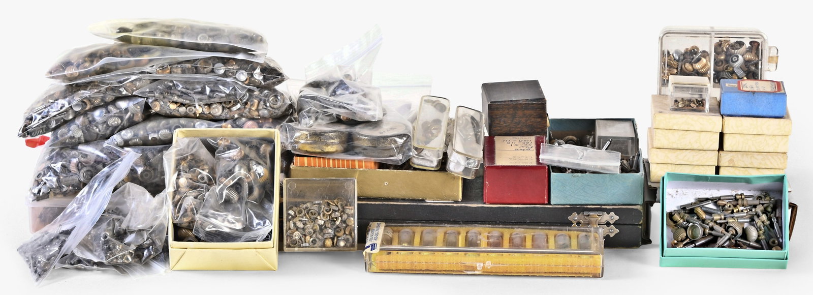 A large lot of pocket and wrist watch crowns, stems and sleeves: A large lot of pocket and wrist watch crowns, stems and sleeves, many gold filled