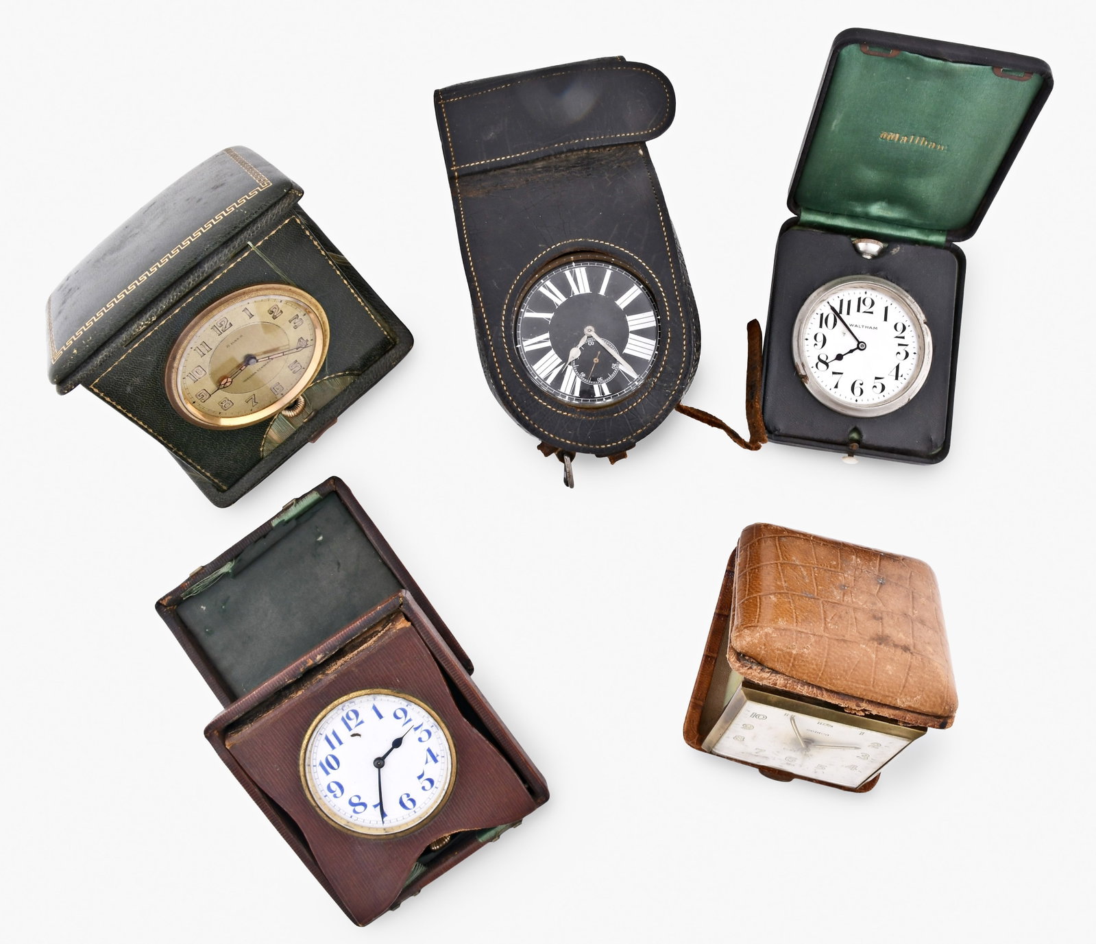 A lot of travel clocks and pocket watch boxes: A lot of travel clocks and pocket watch boxes including a Swiss quarter repeating example in a red leather covered case, a Semca with reptile grain leather covered case, an eight day Eterna in a green