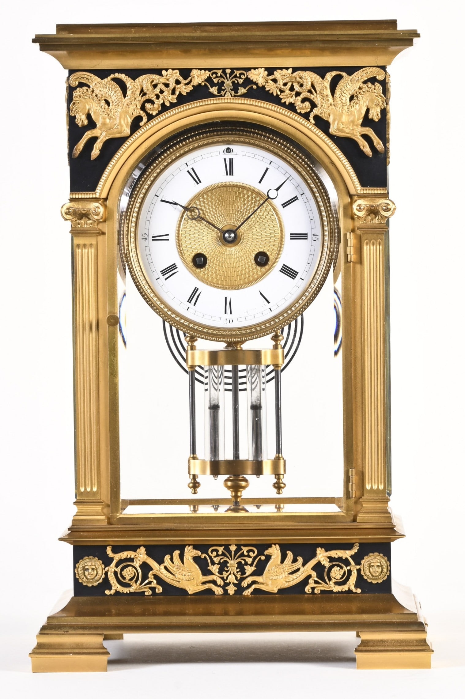 A French large early twentieth century crystal regulator with neoclassical ornament: France, large early twentieth century crystal regulator with neoclassical ornament, gilded brass case with arched front door and lancet arch side lights, molded base with surbase ornamented with gryph