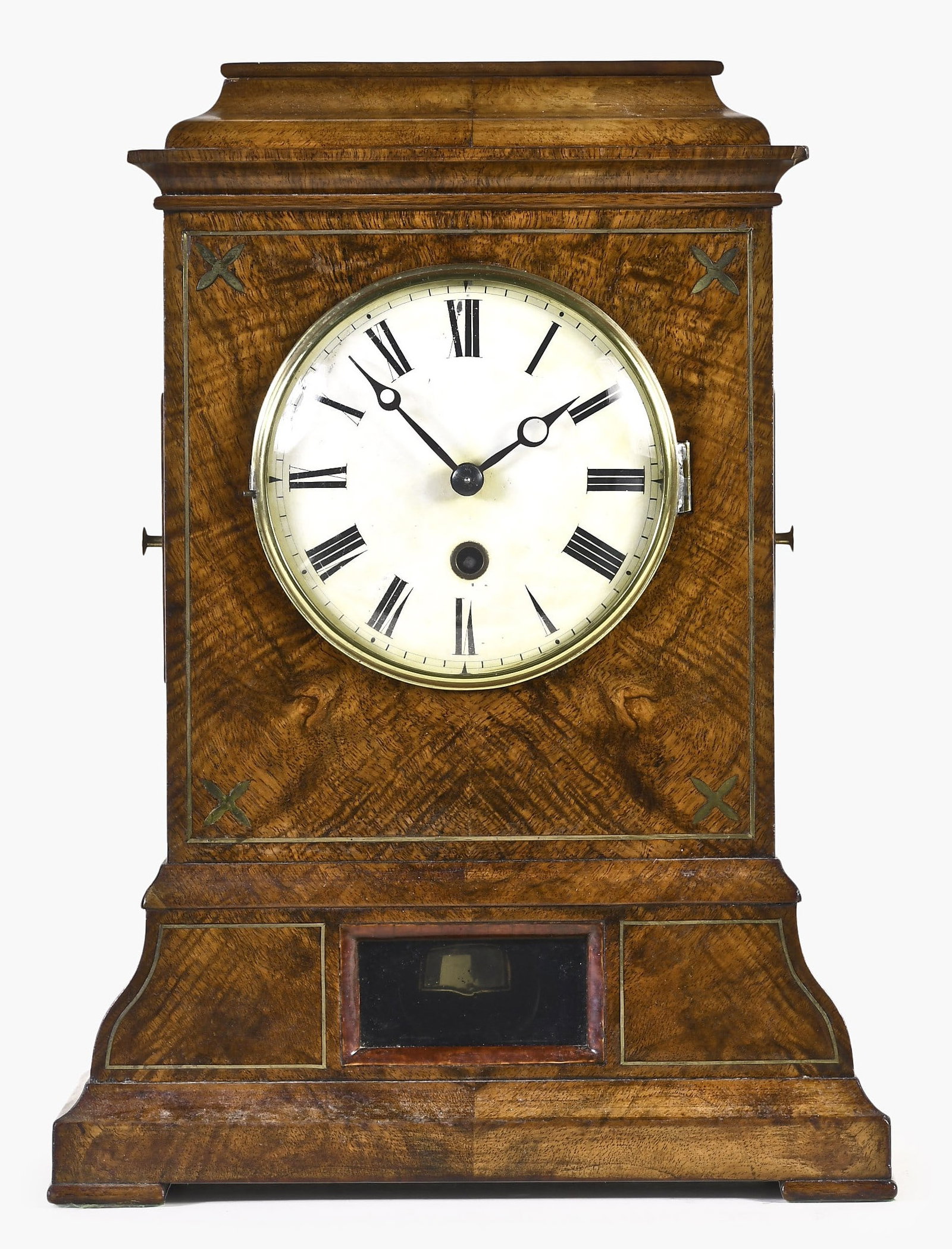 A Black Forest shelf clock: Black Forest, Germany, in a highly figured walnut veneered shelf clock for the English market, brass string inlay on fascia with molded cornice top and top surface panel lifting to reveal storage