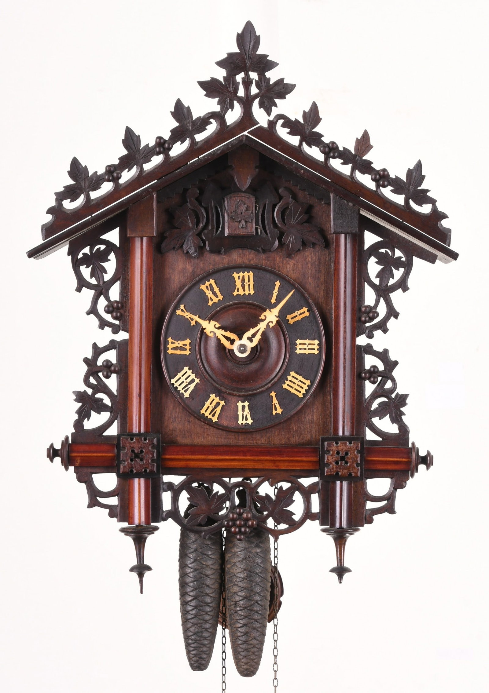 George Kuehl Clock Co. Bahnh?usle railroad style cuckoo clock: George Kuehl Clock Co., Chicago, IL, Black Forest "Bahnh?usle" railroad style case with with carved grapevine and leaf ornament, German 30 hour, cast brass time and strike movement with painted wood c
