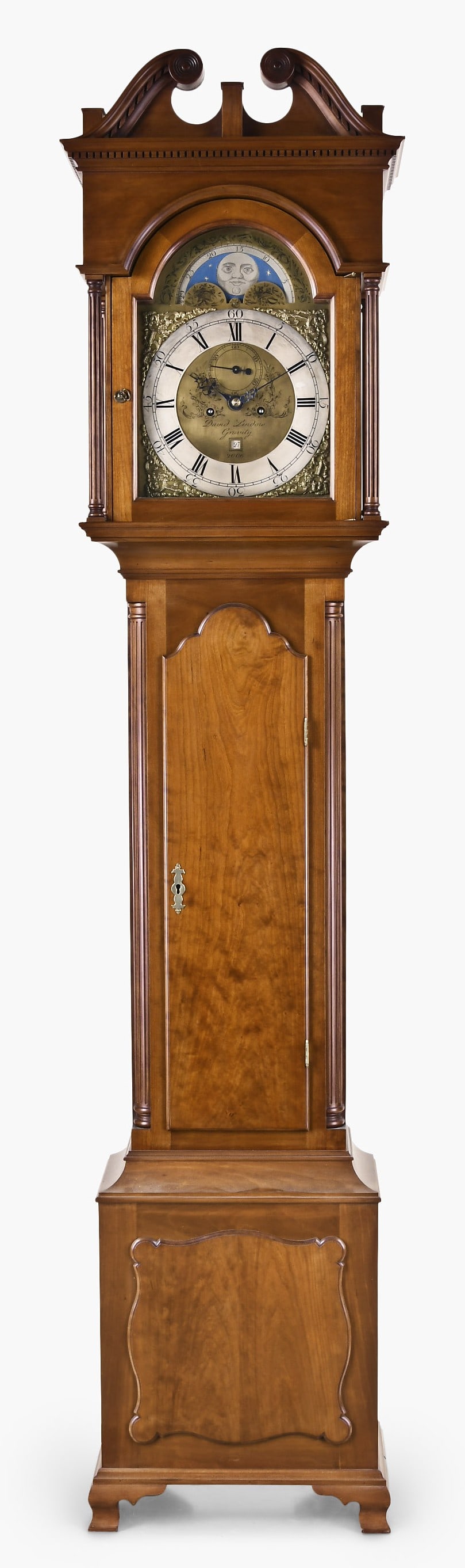 A David Lindow cherry Pennsylvania tall clock: David Lindow, Lake Ariel, Pennsylvania, Pennsylvania tall clock in a cherry case with broken arch top with dental molding below arch and fluted columns flanking hood, fluted quarter columns flanking