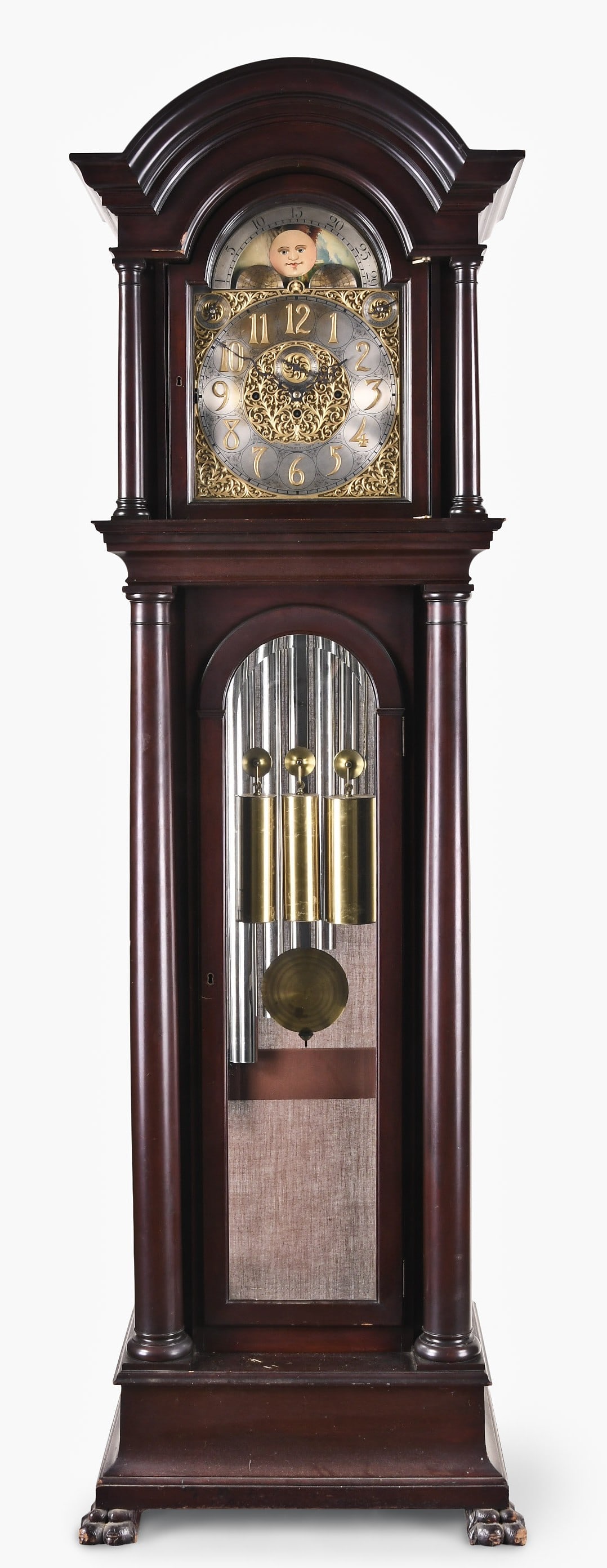 An Elite chiming hall clock: Elite, Germany chiming hall clock manufactured for "A. Stanley Wyckoff 1915" in an architectural mahogany case, arch top above four fully turned columns on hood, full length beveled glasses on the