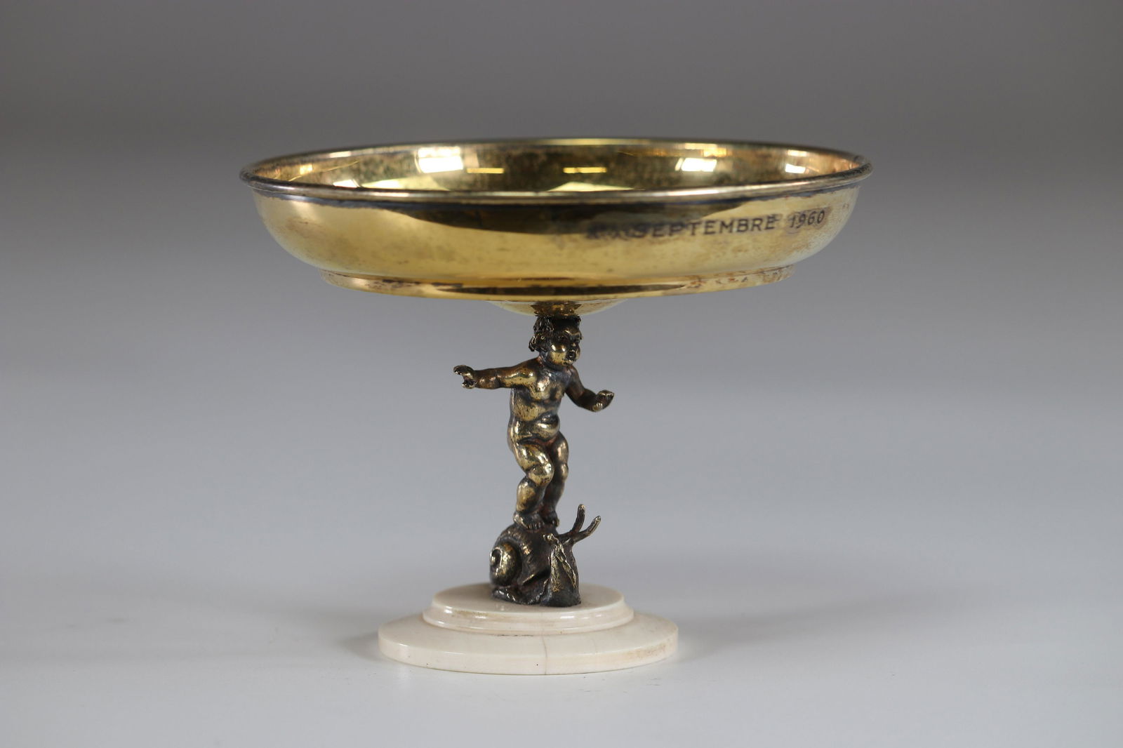 Philippe Wolfers silver cup decorated with a child on a: Philippe Wolfers silver cup decorated with a child on a snailSizes: H=95mm D=115mmWeight (K): 0.174kg