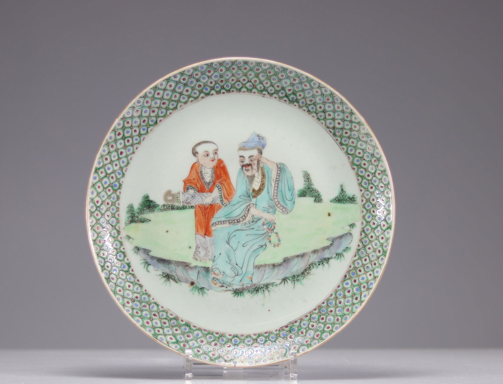 Large porcelain plate decorated with Qing period characters (1 of 2)