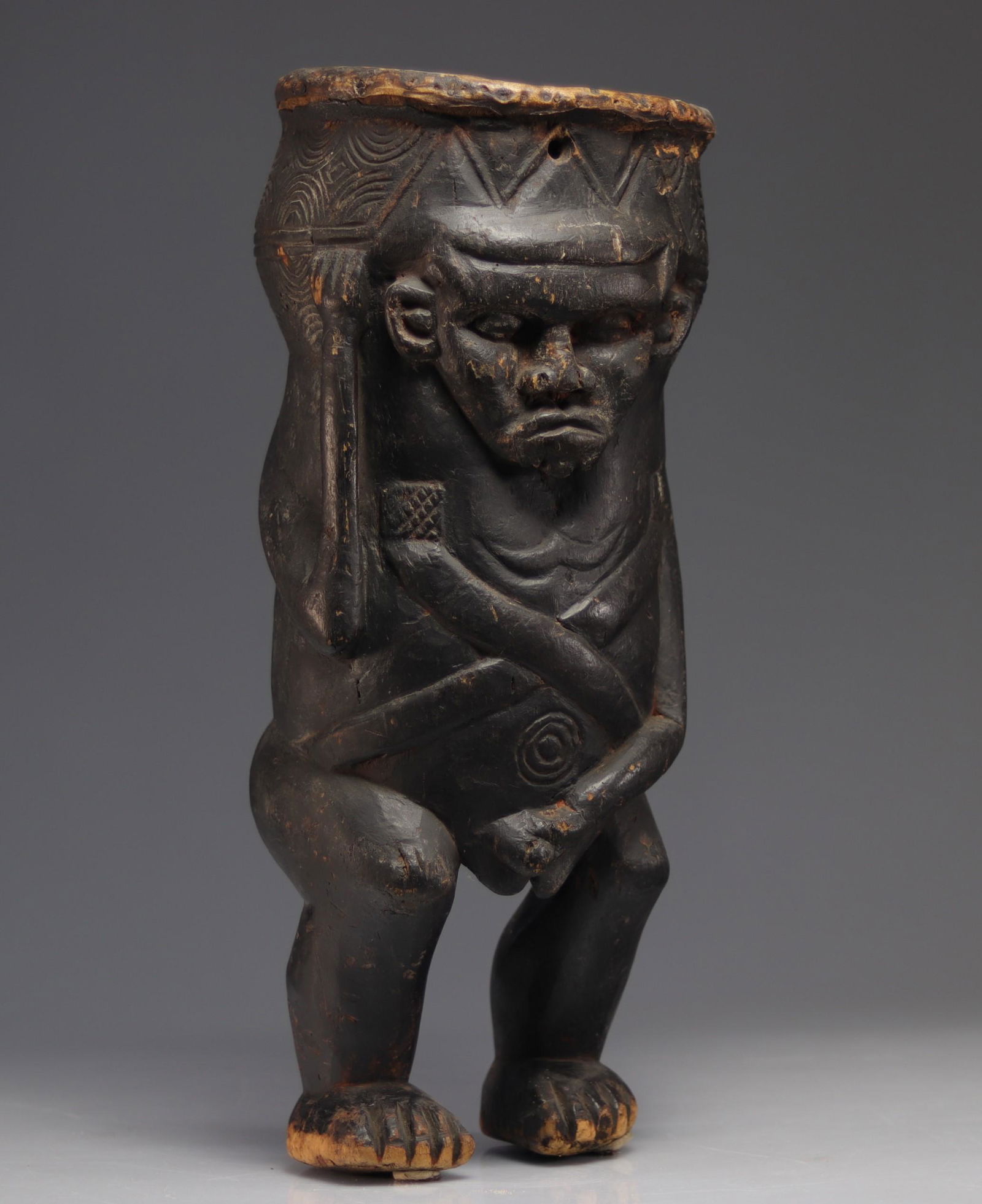 African drum carved with a character (1 of 4)