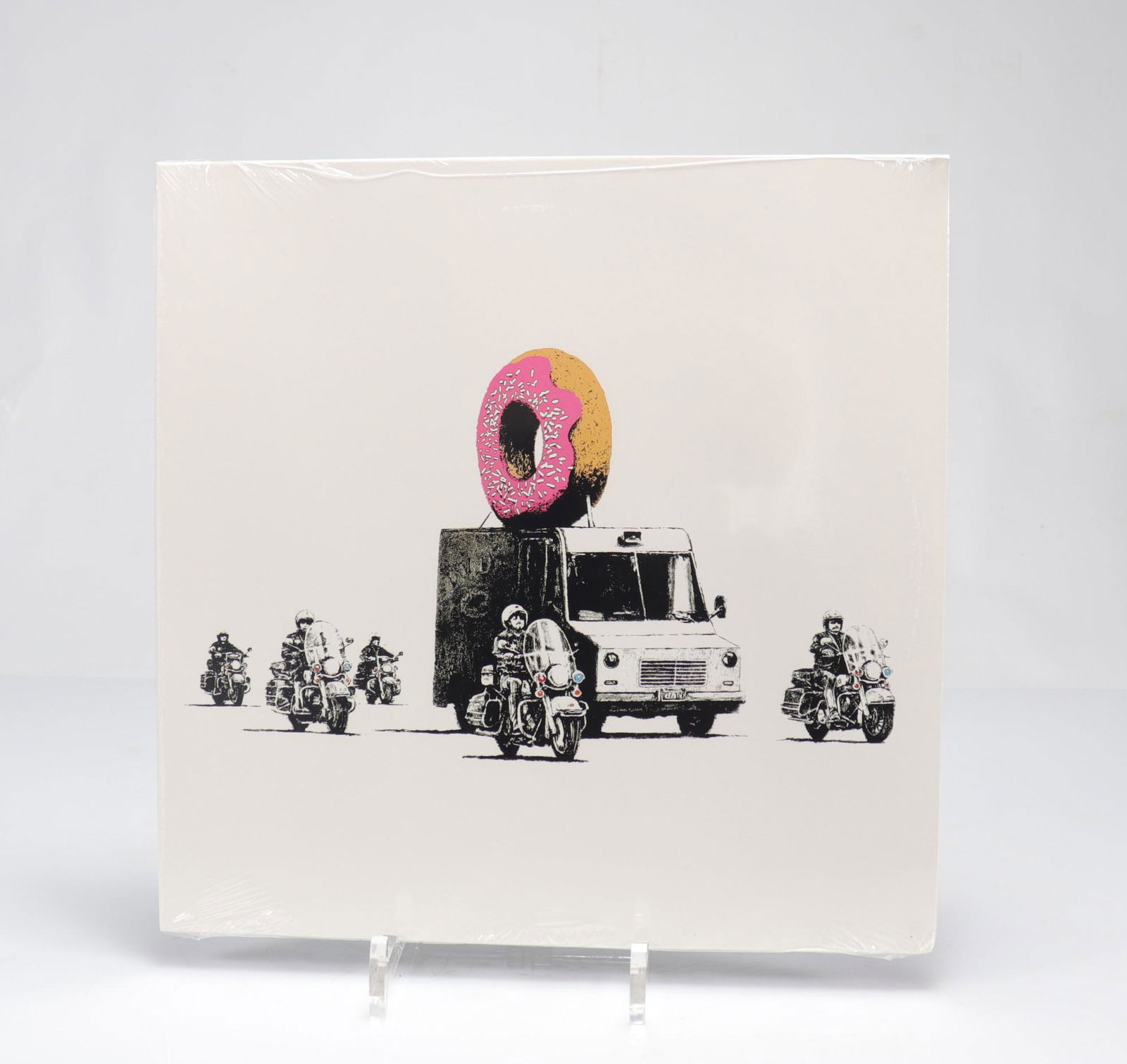Banksy. "Strawberry Donut - Thick As Thieves". Screen-printed record cover. Numbered 9/250. (1 of 2)