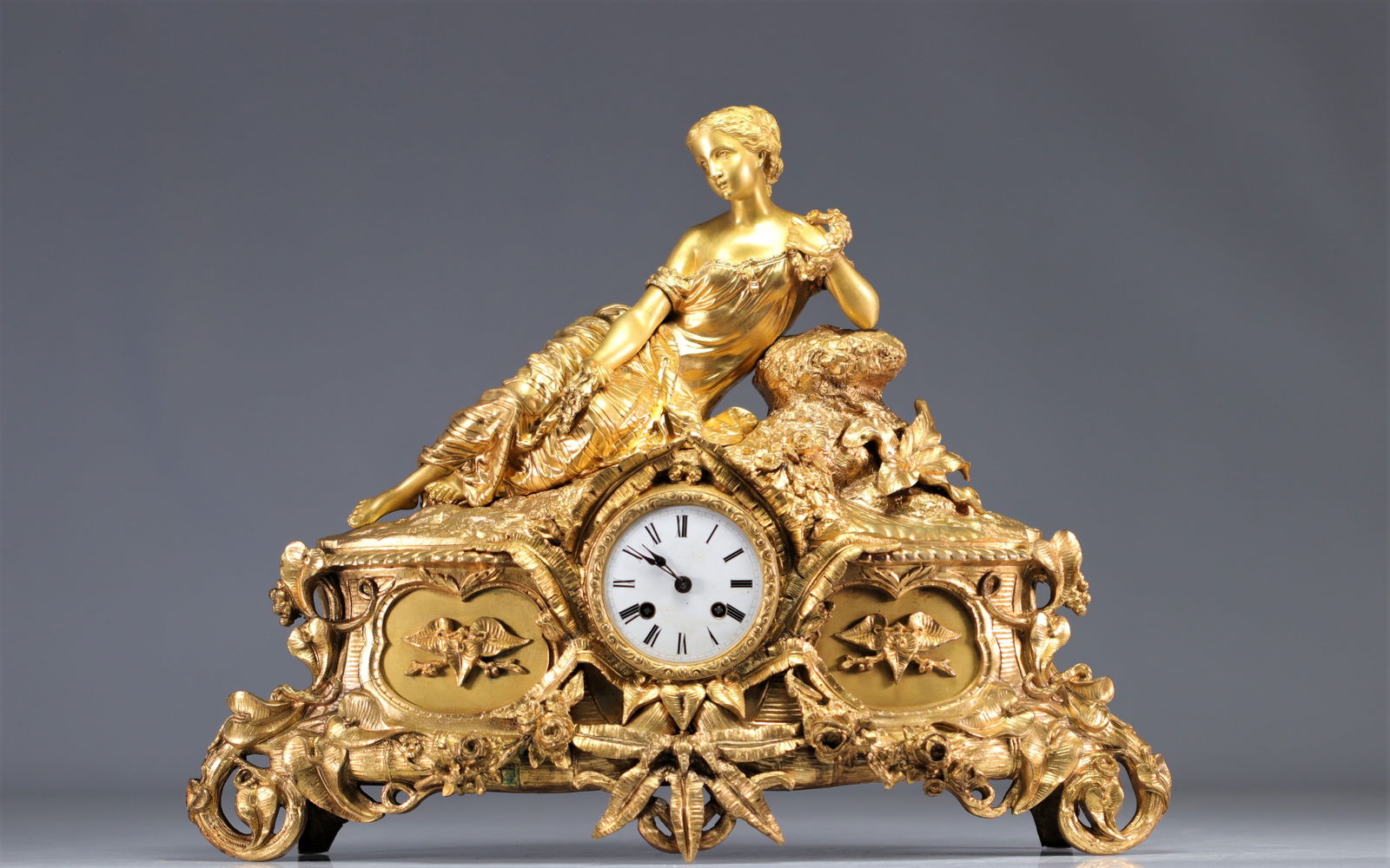 Gilt bronze clock surmounted by a young woman from 19th century (1 of 2)