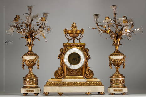 Imposing Louis XVI ormolu and white marble clock and candelabra.: Imposing Louis XVI gilt bronze and white marble clock and candelabra. A pair of crystal candelabras with sprays of flowers. - Weight: 55.00 kg - Shipping unavailable - Region: France - Sizes: H 650MM