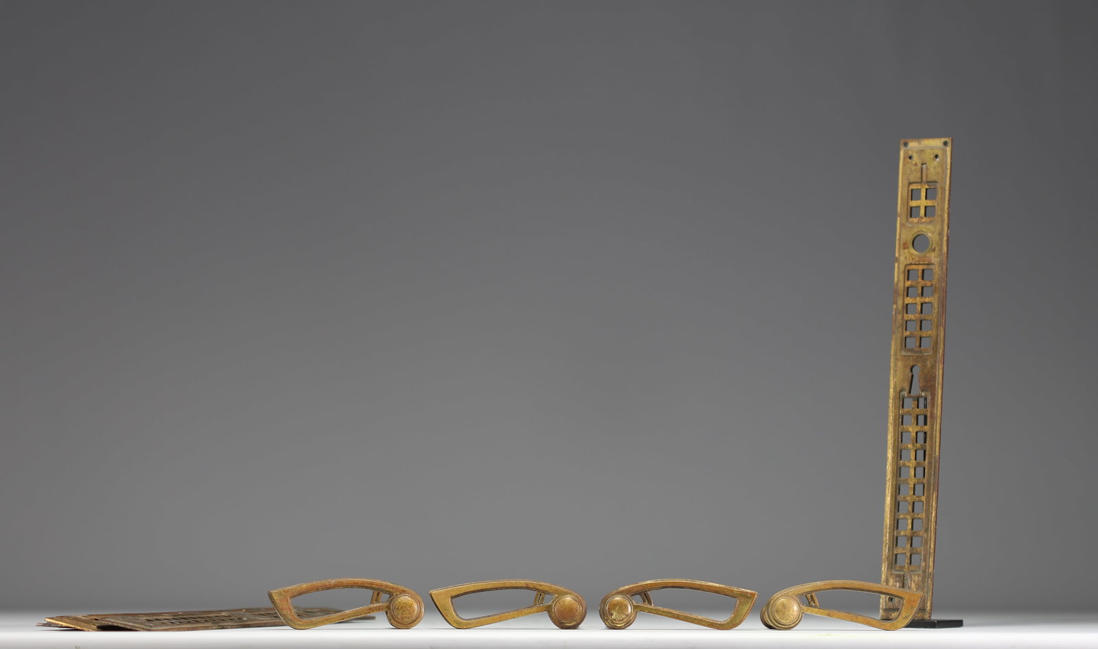 Leon SNEYERS (1877-1949) Two pairs of bronze door handles.: Leon Sneyers (1877-1949) Two pairs of bronze door handles, a combination of rectilinear Art Nouveau work for the nameplates and curved Art Nouveau work for the door handles. Similar door handles and n