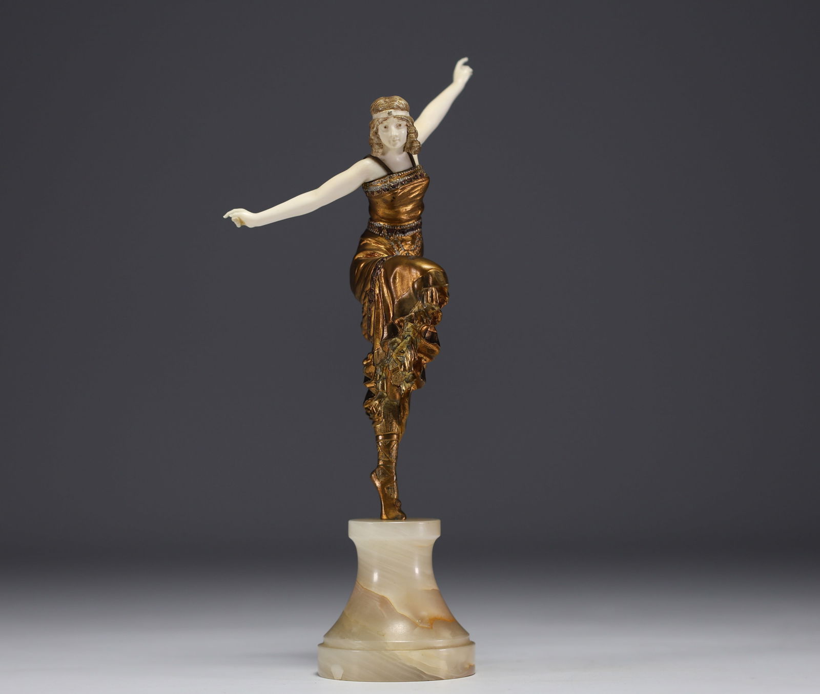 Paul PHILIPPE (1870-1930) "Russian dancer" Bronze and ivory chryselephantine statue on onyx base,: Paul PHILIPPE (1870-1930) "Russian dancer" A chryselephantine statue in bronze with a gilded, polychrome and ivory patina, on an onyx base, circa 1920. Signed on the foot. A CITES certificate will be