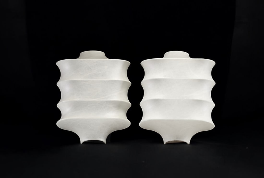 Pair of ‘Cocon’ wall lights, circa 1980. (1 of 2)