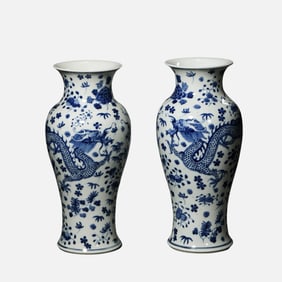 A pair of blue and white dragon-patterned vases from the Qing Dynasty