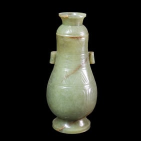 Chinese Han Dynasty animal-faced vase with pierced ears