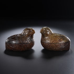 A pair of Chinese Han Dynasty quail jade lidded boxes