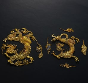 A pair of pure gold dragon-shaped ornaments from the Han Dynasty