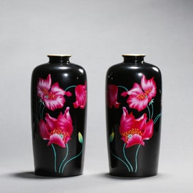 A pair of black-ground famille rose flower-patterned plum vases from the Yongzheng period of the