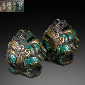 A pair of Chinese Warring States Period inlaid gold, silver and gemstone lion-shaped incense burners